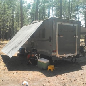 some hooks, a tarp, and string makes a great awning for the generator and coolers.