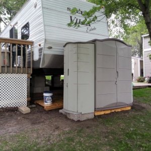 Sheds relocated to front of trailer to open up lake view from the deck.