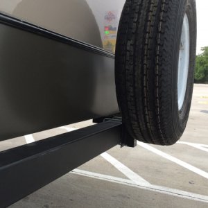 Raised spare tire mount after dragging it off.