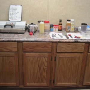 I added the kitchen counter in the garage area for storage and prep area.  I raised the counter to my desired height.