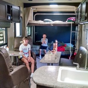 Kiddos getting settled in on maiden voyage. So nice to be able to leave beds made/down in the rear and still enjoy the couch and chairs in the main ar