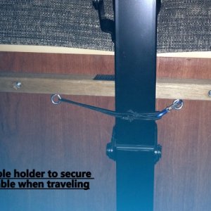 Added a small eye-bolt and latch to hold table in place while traveling.