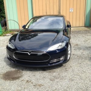 2015 Tesla. 100% electric. It can be charged at any RV camp site. 30 or 50 amp.    Car will drive 300 miles on a full charge.