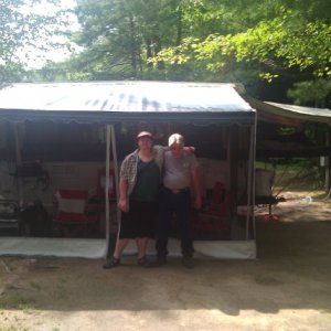 My son and I Stand outside our screened Room.