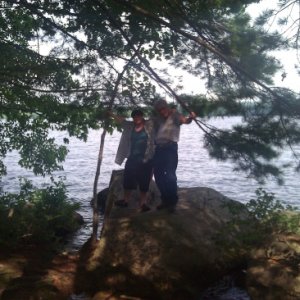 My son and I standing on a huge rock right at the front of our site on Long Lake.