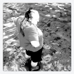 Michelle standing in the water at the boat ramp.