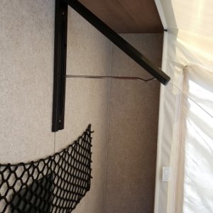 The collapsible closet rod open.