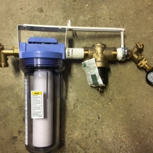 Water filter and regulator assembly.  First Y allows for a hose to be used for washing feet or other purposes.  Y at end allows for pressure gauge to 