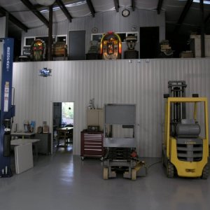 This is the auto shop looking west with mezzanine above the wood shop which is seen through the door. Jukeboxes are 1941 Wurlitzer 850 and a 1948 Wurl