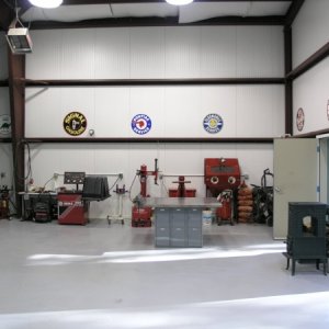 this is a portion of the north wall, showing tire area, bead blasting, and one of the two highly efficient wood stoves made by Jotul of Norway.