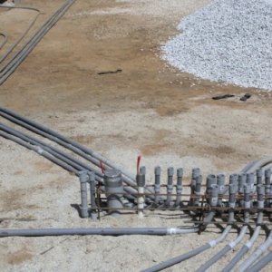 under slab electric conduits shown prior to sand cover , moisture barrier and capillary break install. They are running to strategic locations through