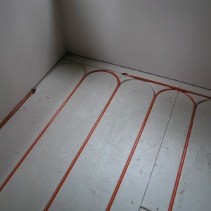 just a couple shots of the floor heat, 7 zones of low temp. heat, product called Warm-Board, it is 1 1/8" plywood covered with aluminum to conduct hea