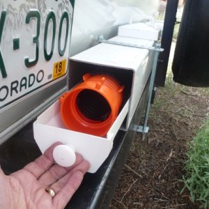 4 inch plastic gutter with end caps and cabinet knob.