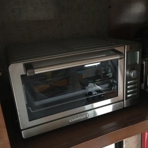 Convection oven fits perfectly next to our 3 qt Instant Pot in the cupboard above the dinette.  Door shuts without a problem, and stays latched.