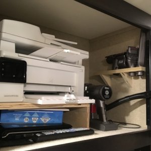 Made shelf for our printer and Dyson vac behind the bedroom tv