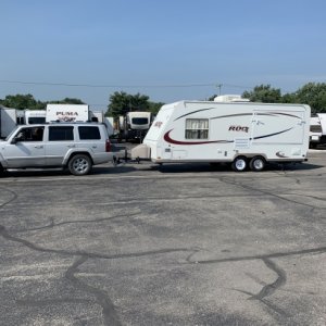 Truck and Camper leaving Dealership