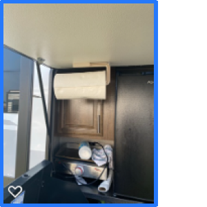 Paper towel rack inside outside kitchen, on door.