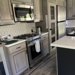 Lovely kitchen with full-size oven and lots of counter, storage space.