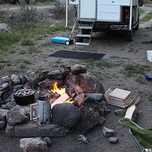 Fire pit with dutch oven action