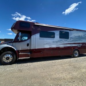 The reflection of windows and clouds on the paint work is interesting.