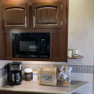 Added a Small Corner Shelf to the Side of the Upper Kitchen Cabinets