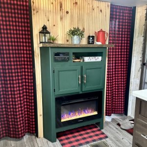 Fireplace Surround - After
- sanded entire cabinet
- removed top shelf, replaced with rustic piece of wood
- painted cabinet with Fusion Mineral paint