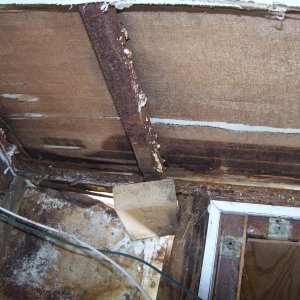 both front corners & along lower front wall was partly rotted & will need replaced --