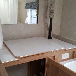 Storage cabinet and mirror in bath