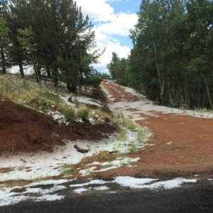 Snow alongside the road to Cripple Creek.  At first, thought it was fire retardant due to recent fires!