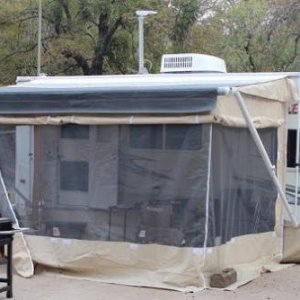 It came with a screened room that had never been used. It had to be fitted to the trailer and awning, but once that was done, set up was pretty easy. 