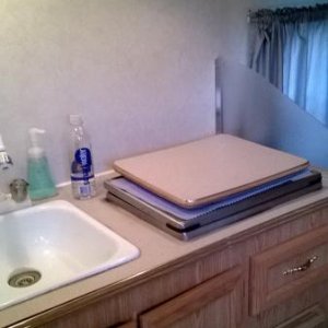 kitchen with microwave in cabinet above