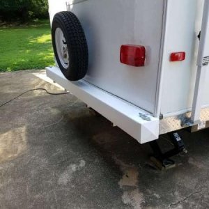 Sewer hose storage bumper made DIY from 5" vinyl fence post.