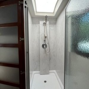 Incredible Corian lined 32x32 shower in dry bath.