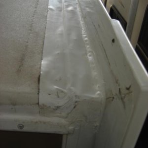 Dealer replaced eternabond on 2 slides and in the process pulled roof membrane loose causing bubbles in finished product