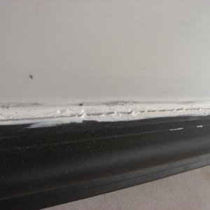 Dealer used lapsealant to caulk new bulb seal, already cracking