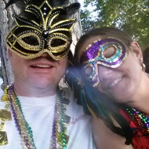 Todd and Theresa at Mardi Gras party :-) Rare view of Todd wearing feathers. Hahaha!