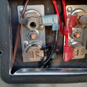 Water Heater thermostats showing wiring indention's from cover and metal edges