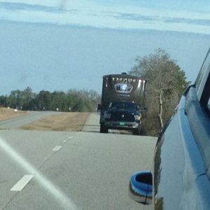 A shot from the Dodge Journey looking back in the side view mirror at our Ram 1500 pulling the SF32RL.