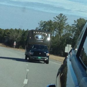 A shot from the Dodge Journey looking back in the side view mirror at our Ram 1500 pulling the SF32RL.