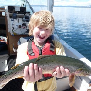 My son expressing how fun catch & release can be of native cutthroat trout on Yellowstone Lake.  We had a really fun day!