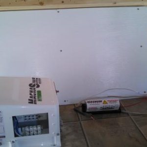 This is what I would refer to as the North wall.  The wall separating your batteries/propane from the interior of the trailer.  This cargo area in our