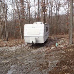 At last... At Home.  The Jayco Eagle 266 FBS arrives at the home base.  It lived at a nearby campground for over a year while the house was constructe