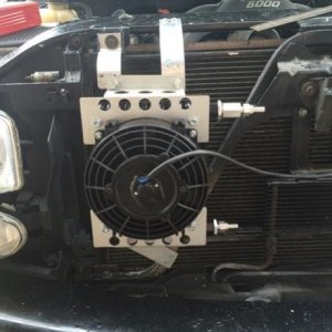 In an effort to keep the transmission cooler and reduce heat fluctuations I added a Derale 13950 Atomic-Cool Remote Cooler. The 180 degree thermostat 