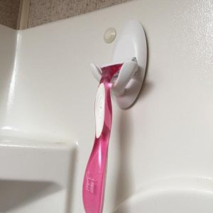 Double Command Hook used as a razor holder.