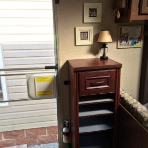 Installed a Closetmaid cabinet to store our shoes. If you look to the left of the cabinet you will see a dimmer switch, which is connected to the lamp