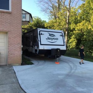 Almost got it positioned perfectly.  Would like it about a foot closer to the wall.  Need to get a trailer dolly to help move this thing.  Hooked and 