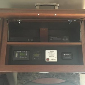 Split the overhead compartment to make room for a shelf for a Blu-Ray player and Winegard controller.