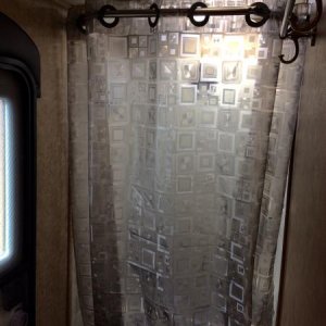 Installed a translucent shower curtain to let in more light but still feel somewhat private.