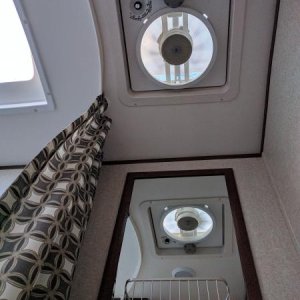 Vortex 2 fan in bathroom. Also visable is brushed nickel basket mounted to bathroom mirror.