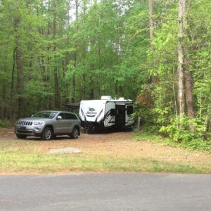 The Jeep and the Whitehawk 23MRB sitting back in a very private and wooded spot.